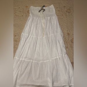 Long flowy strapless white beach dress